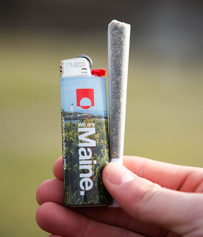 East Coast Cannabis pre-roll with We Are Maine lighter