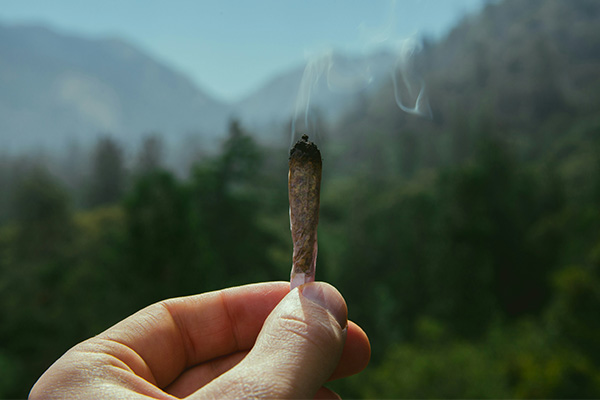 a lit pre-roll in front of a mountain scene